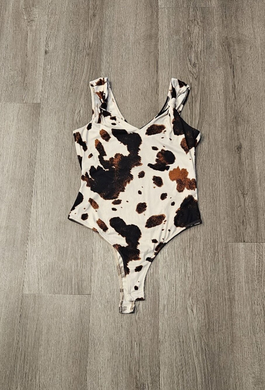 Altar'd State Cow-Print Scoop Neck Bodysuit in White, Brown & Black